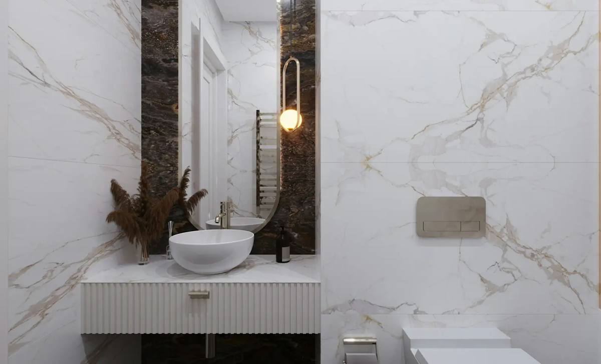 Baño reformado con mármol oscuro, en Alzira