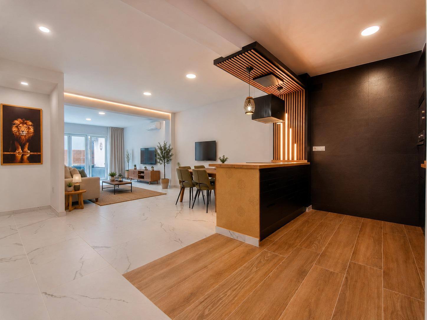 Salón y cocina en planta abierta tras la reforma integral